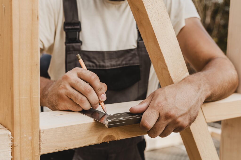 person taking measures wood
